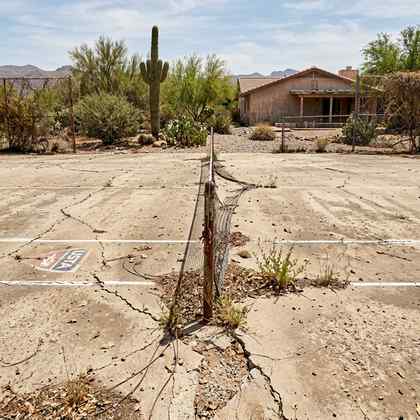 Worn concrete pad before conversion